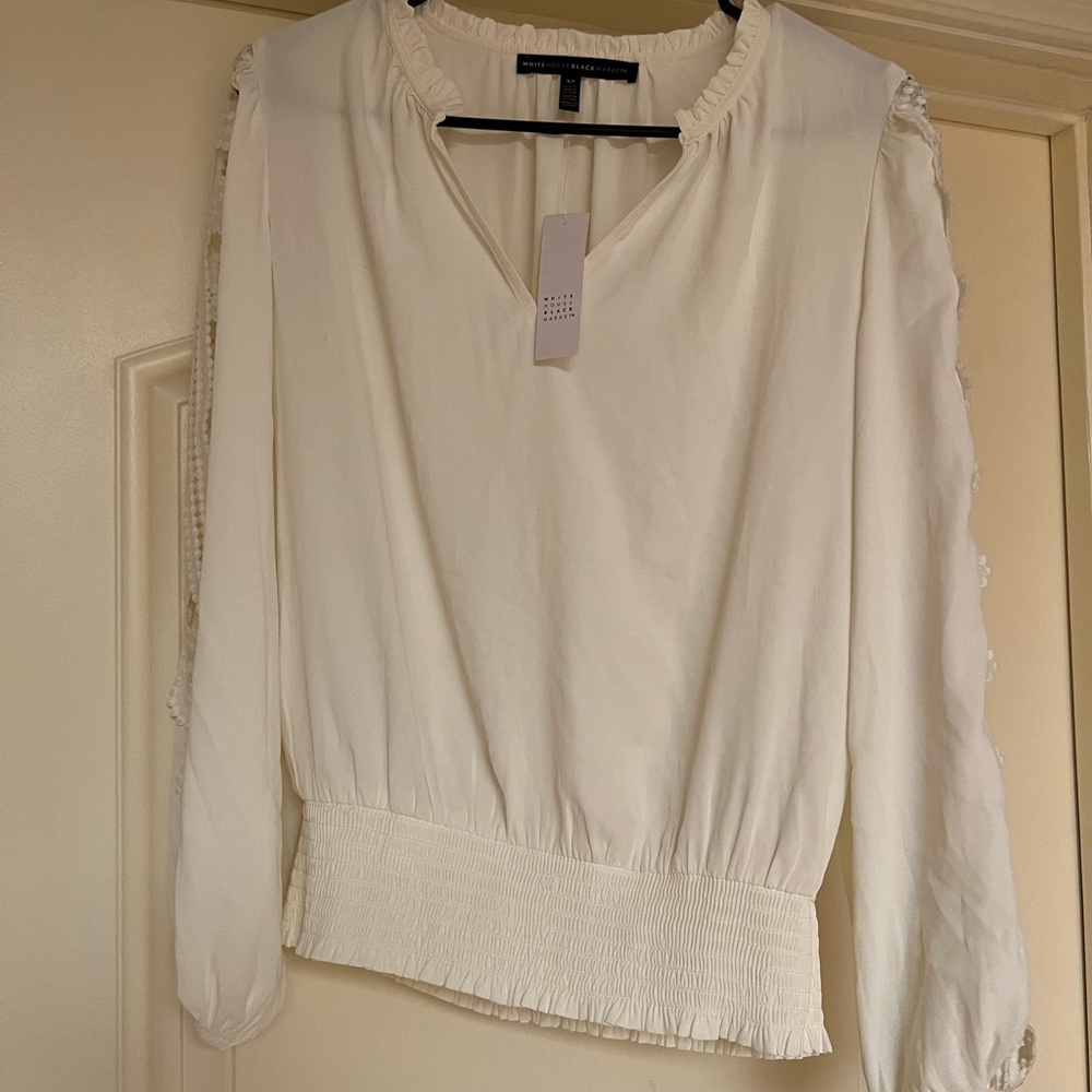 White House Black Market White blouse with detailing on sleeves
